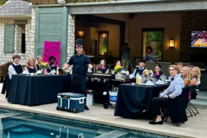 Private hibachi catering service with a chef preparing meals at a client's home, offering a unique dining experience